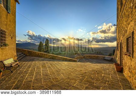 Montegemoli Old Village Square And Panoramic Landscape At Sunset. Pomarance, Pisa Province, Tuscany,