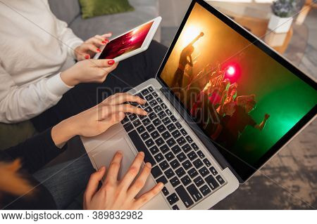 Two Friends Watching Online Party, Tv Or Cinema Together With Devices. Online Entertainment, Communi