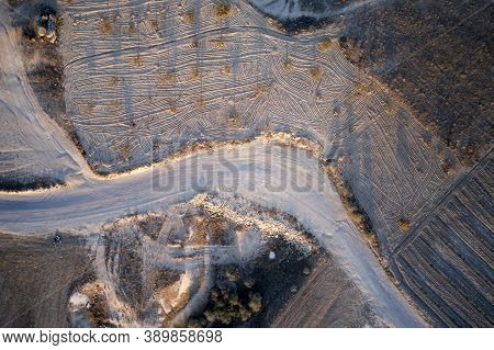 Desert Landscape With Dust Off Road. Traces Of Quad Bikes, Top View. Safari And Extreme Travel.