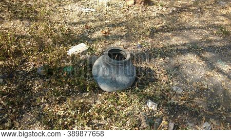 Old Unused Earthen Pot In Rural Indian Village Filled With Mud