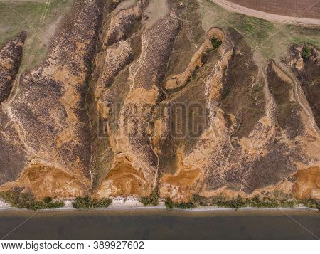 Aerial Shot Of Clay Hills With Canyons Near The Black Sea At Misty Autumn Weather. Stanislavs Mounta