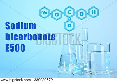 Text Sodium Bicarbonate E500 With Soda Formula And Laboratory Glassware On Background