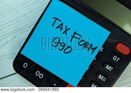 Tax Form 990 Write On Sticky Notes Isolated On Office Desk.