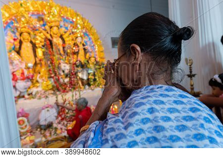 Kolkata, West Bengal, India - 6th October 2019 : Old Aged Woman Praying To Traditionally Decorated ,