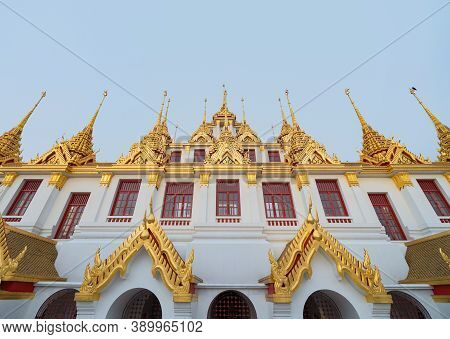 Loha Prasat Wat Ratchanatda Pagoda, A Buddhist Temple Or Wat Saket Buildings With Blue Sky In Bangko