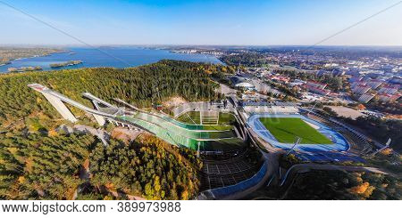 Aerial Panoramic View Of Lahti Sports Centre With Three Ski Jump Towers.