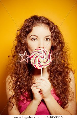 Happy young Woman with lollipop