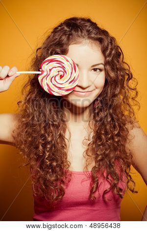 happy young woman with lollipop