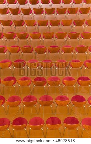 Chairs lined up on a tile floor