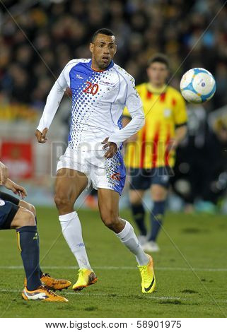 BARCELONA - DEC, 30: Cape Verdean player Carlos Lima Calu in action during the friendly match between Catalonia and Cape Verde at Olympic Stadium on December 30, 2013 in Barcelona, Spain