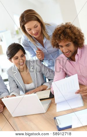 Group of business people meeting aroung table
