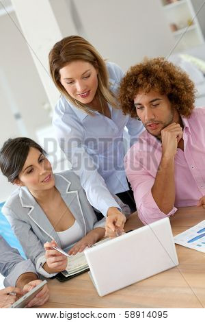 Group of business people meeting aroung table