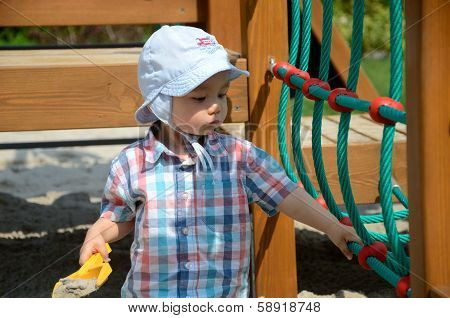 Baby Boy In Sandpit