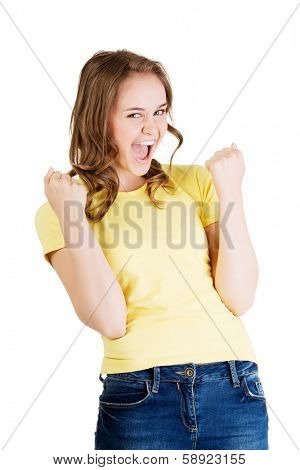 Excited happy success young woman with fists up, isolated on white