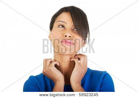 Young beautiful woman scratching her self. Isolated on white 