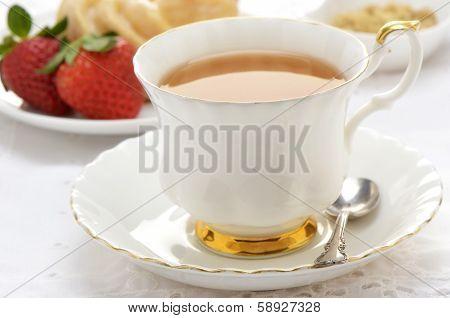 Tea  With Cruller And Strawberries