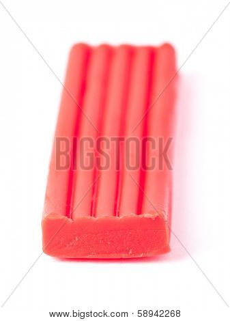 Single bar of plasticine isolated on white background