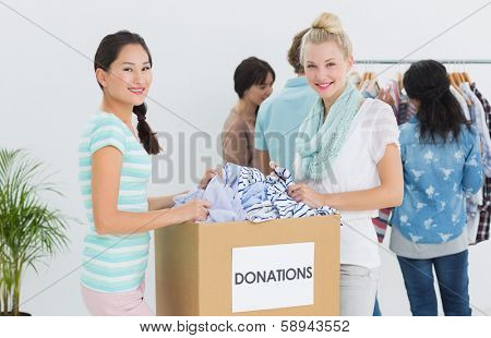 Group of young people with clothes donation