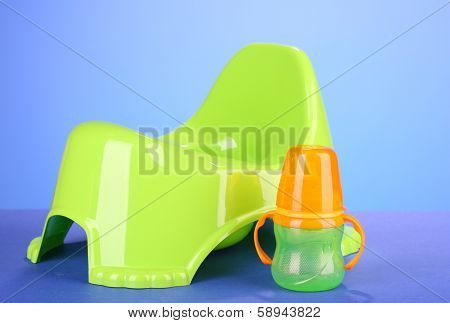 Green potty on color background
