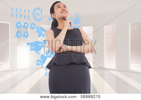 Thinking asian businesswoman against green arrow pointing up against sky