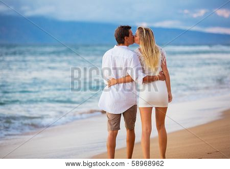 Romantic Couple Enjoying Sunset on Beautiful Tropical Beach, Love Honeymoon Concept