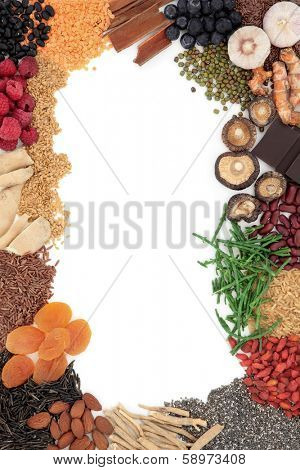 Super food selection forming an abstract border over white background.