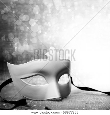White mask with glittering background