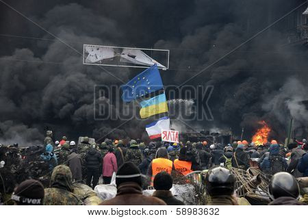 KIEV, UKRAINE - JANUARY 23, 2014: Anti-government protest in Kiev,  Grushevsky str.  People defend barricades.