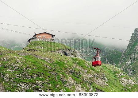 Fagaras Mountains Beautiful view of Balea Lake and Balea cottage Carpathians Mountains.