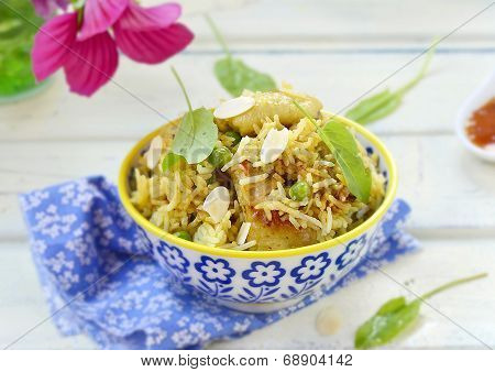 Pilaf With Chicken, Peas And Almonds