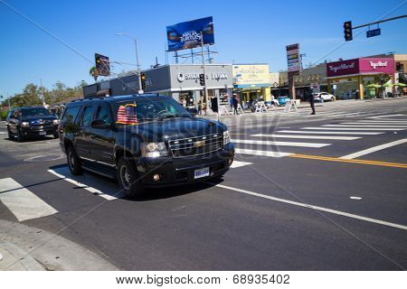 LOS ANGELES - July 23, 2014: President Barack Obama's motorcade crossing corner of 3rd Street and La Brea Avenue during presidential visit to LA.