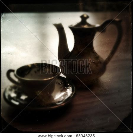 Instagram filtered image of a teacup and teapot 