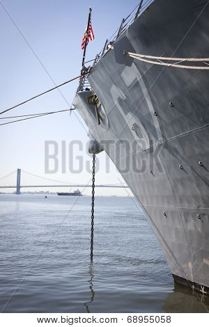 STATEN ISLAND, NY - MAY 25, 2014: The bow of the guided-missile destroyer USS Cole (DDG 067) moored during Fleet Week NY at Sullivans Piers with the Verrazano-Narrows Bridge in the background.