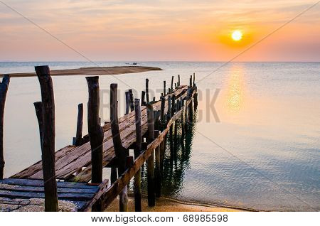 Sunset With Old Ruin Of Pier.