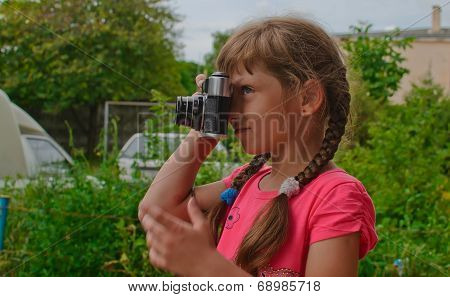 Young Girl With Camera