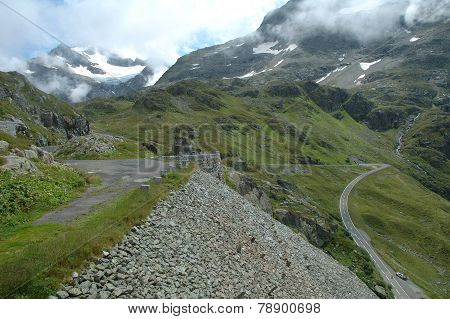 Road On Hillside In Alps In Switzerland