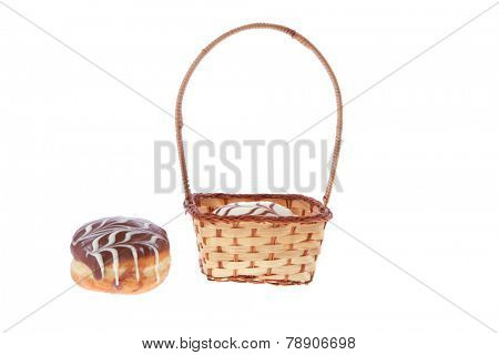traditional jewish holiday chanuka donuts covered by dark and white chocolate pattern on retro vintage basket isolated on white background