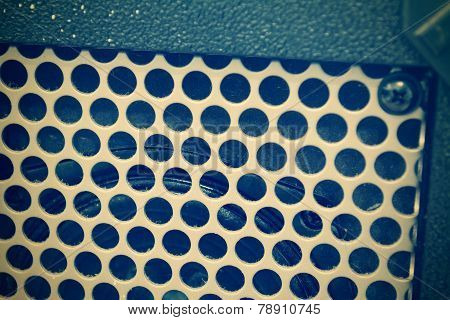 Close Up Of A Guitar Amplifier Grill In Vintage Tone