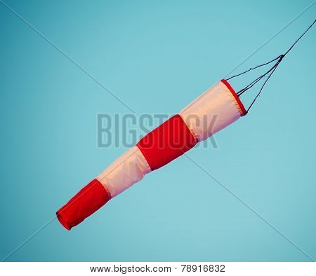 Close Up Of A Wind Sock Under A Blue Sky In Vintage Tone
