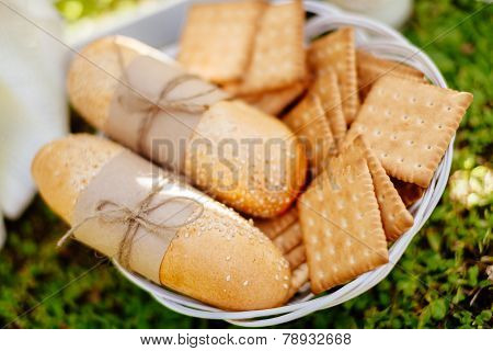 Buns And Cookies On The Plate With Green Grass Background