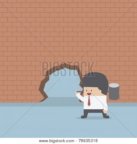 Businessman Breaking The Wall With Hammer
