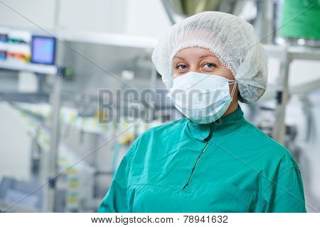 pharmaceutical factory woman worker at tablet production line in pharmacy industry manufacture factory
