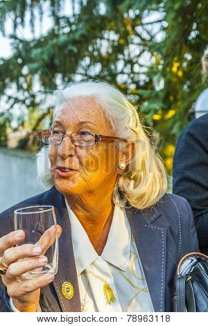 Woman Enjoys The Party And Holds A Glass Of Water In Her Hand
