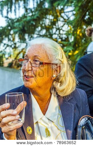 Woman Enjoys The Party And Holds A Glass Of Water In Her Hand