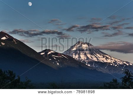 Mountain Landscape Of Kamchatka: Evening View Of Viluchinsky Volcano And Moon
