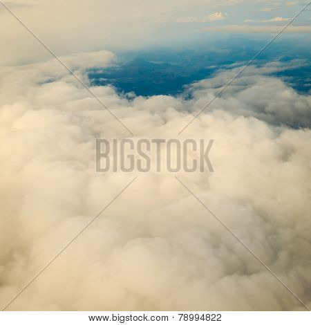 White Cloudy Sky. View From Airplane Flying In Clouds.