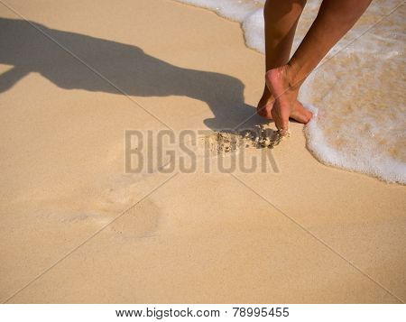 Woman walking on the sandy beach - Selective focus