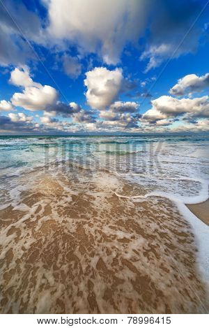 waves lapping on the sandy beach