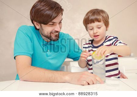 Father and son make lemonade