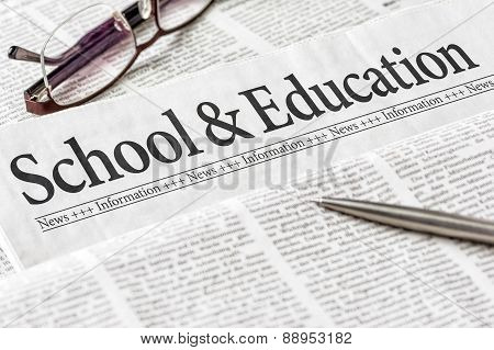 A Newspaper With The Headline School And Education